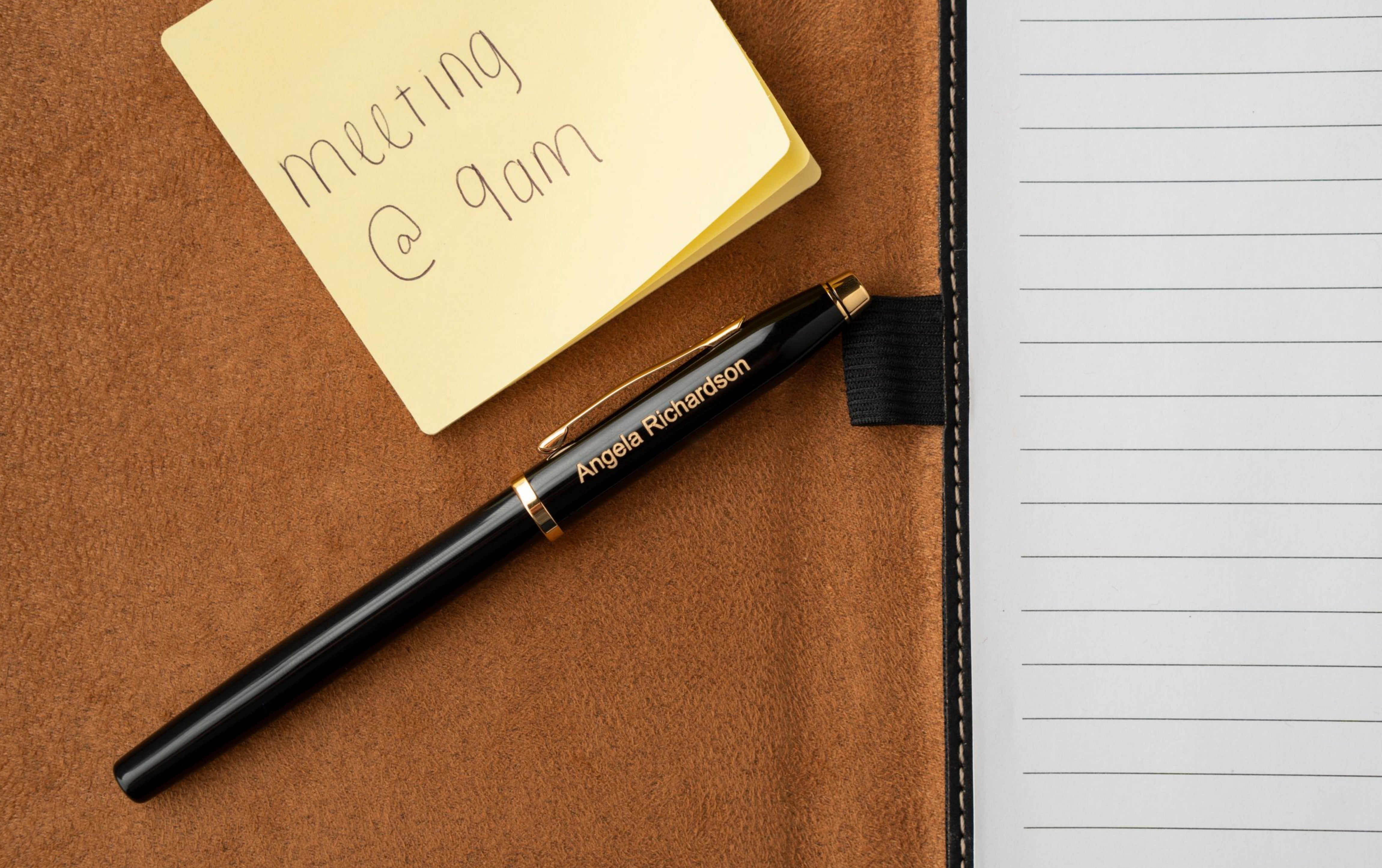 engraved Century II black Fountain Pen next to sticky note