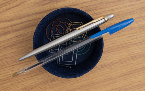 The Parker Jotter Stainless Gold Trim Pen and the BIC Cristal