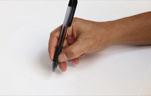 person holding a black pen