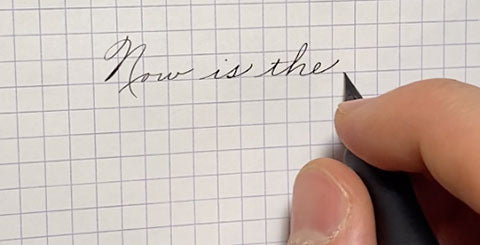 pen writing in notebook