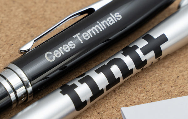 Imprinted pen and an engraved pen