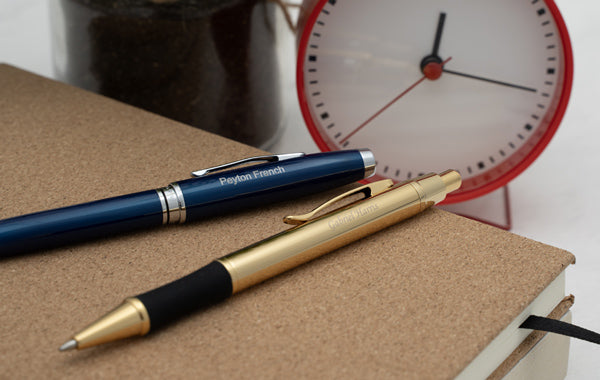 Engraved pens and a clock