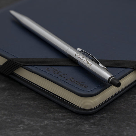 Cross Chrome Click Pen on a Blue Cross Journal