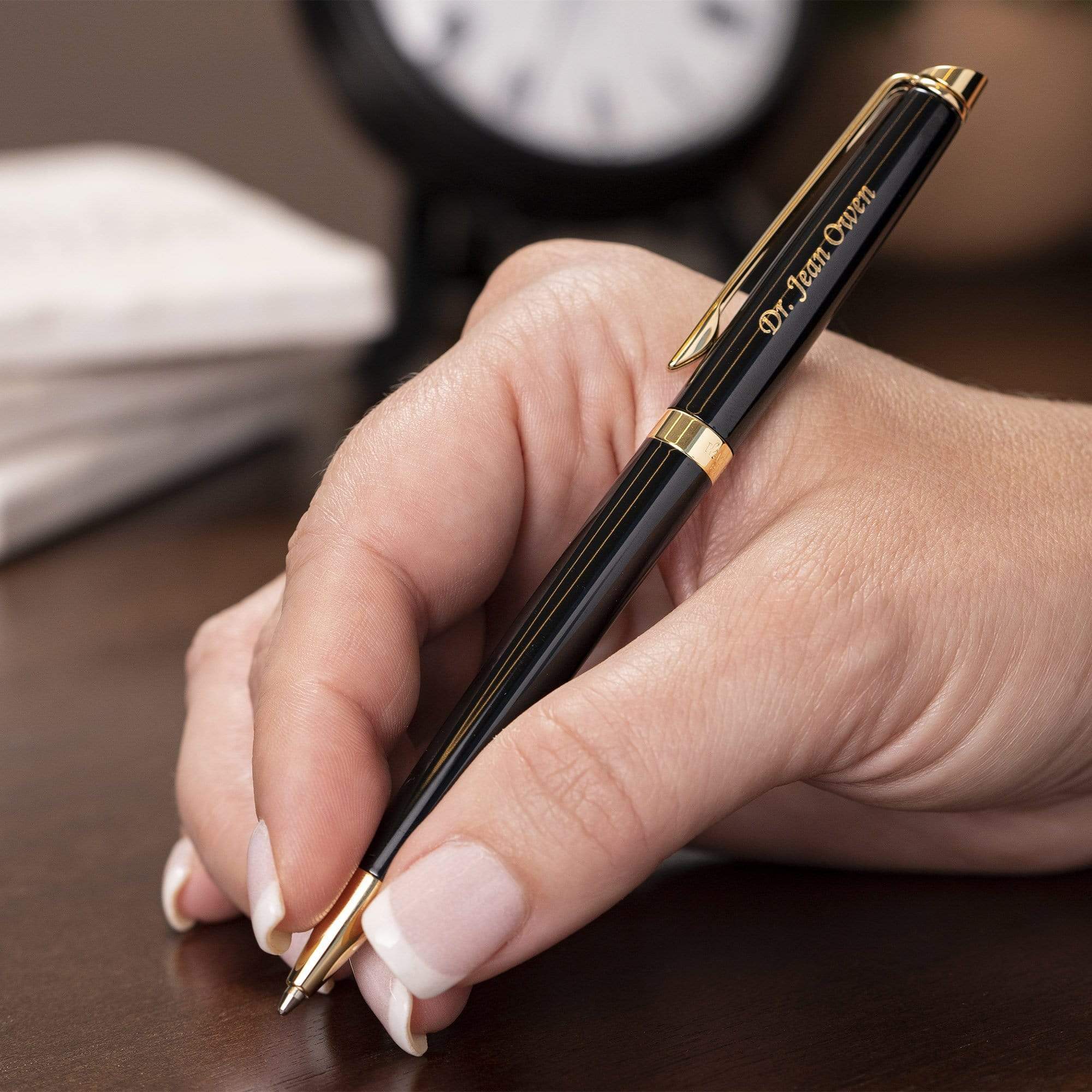 hand holding Black Gold Waterman Hemisphere