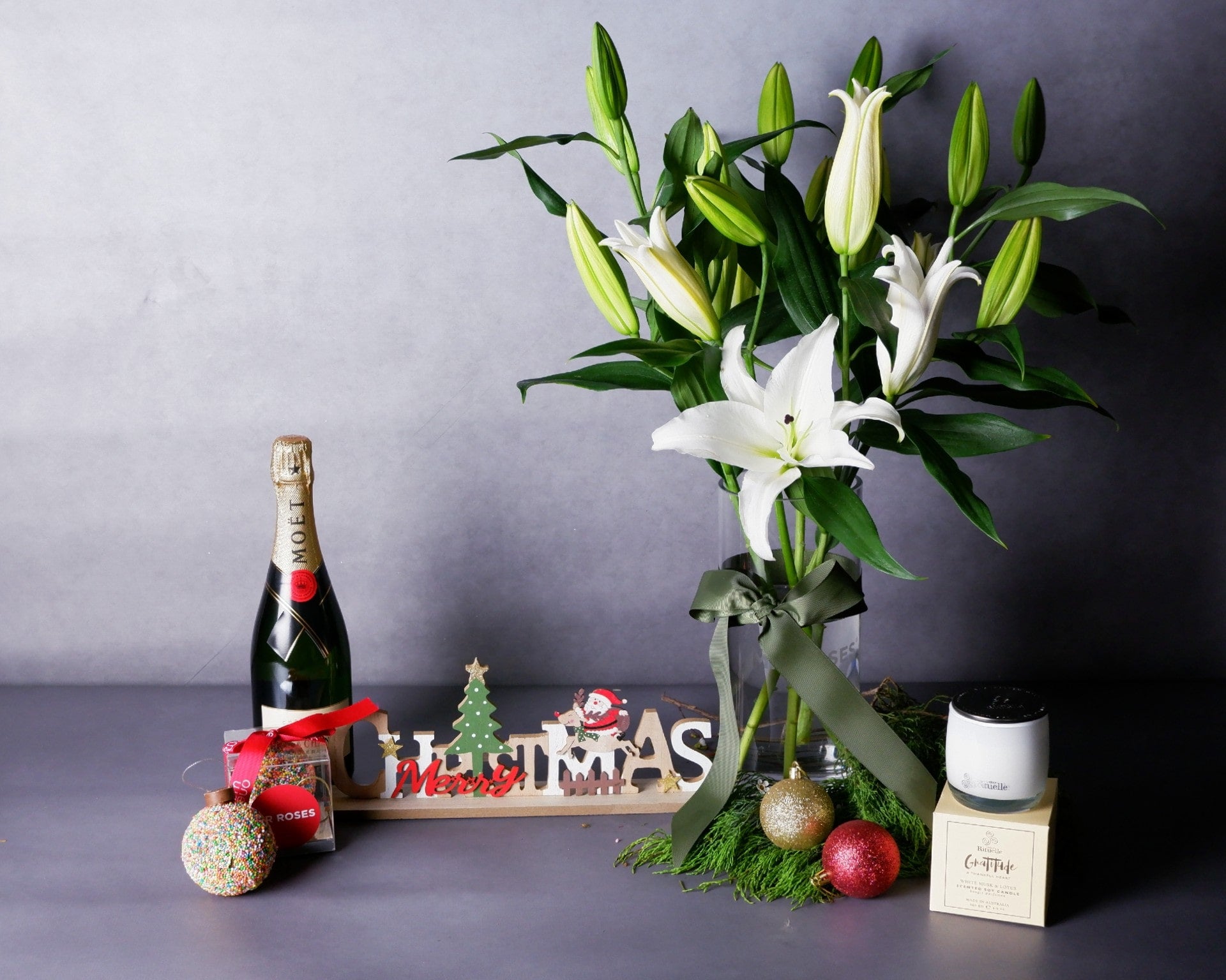 Image of Lilies, Chocolate Bauble, Scented Candle & Champagne Christmas Bundle