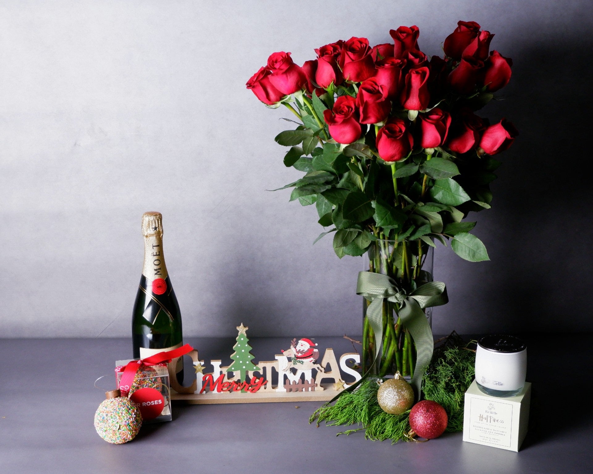 Image of Merry Red Roses, Chocolate Bauble, Scented Candle & Champagne Christmas Bundle