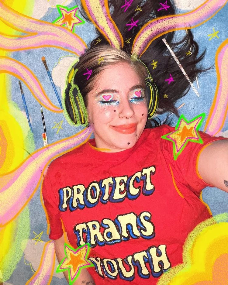 Rhiannon wearing a Protect Trans Youth T-shirt