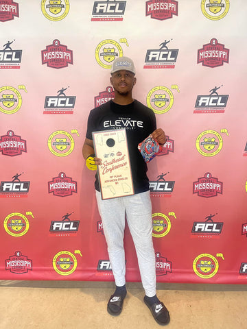 ACL PRO Tyrell Maxey with the Gladiator Cornhole Bags and a Trophy