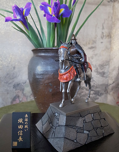 Warlord Oda Nobunaga's statue on horse being displayed with flowers.