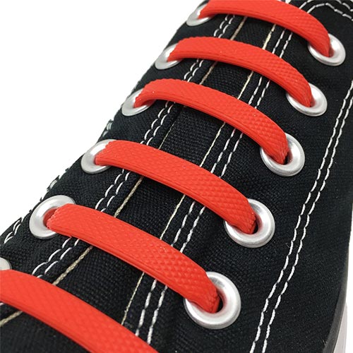 black sneakers with red laces