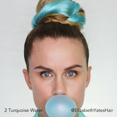 Long Hair Influencer wearing Turquoise Water Blue Easy Updo Extensions in a big Topknot bun blowing a blue bubble with bubble gum
