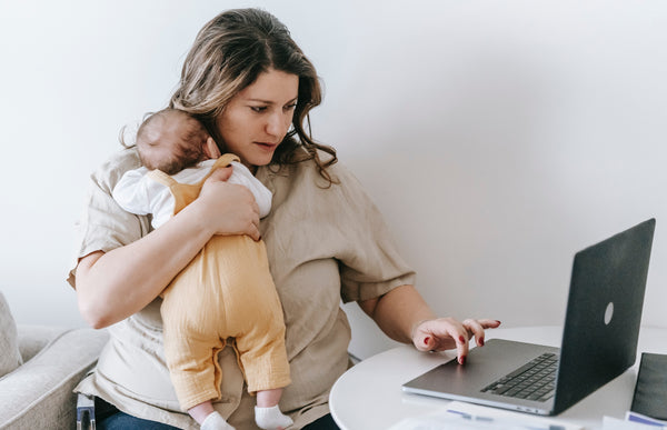 Busy mom balancing work and baby