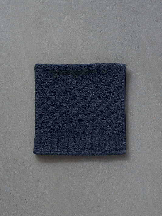 https://cdn.shopify.com/s/files/1/0102/0175/9810/files/mujo-store-kontex-lana-face-towel-navy.jpg?v=1686530778&width=533