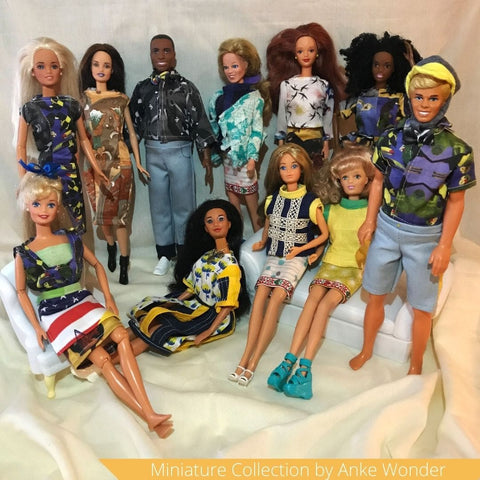 A collection of Barbie dolls wearing Anke Wonders outfits as miniature versions.