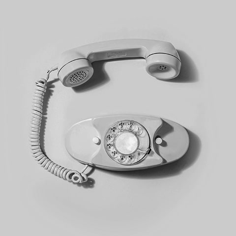 Black and white photo of an old-fashioned landline telephone.