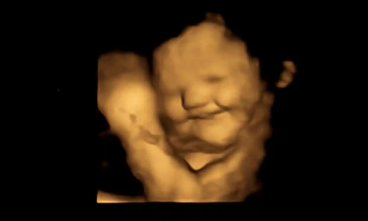 Smiling baby in the womb