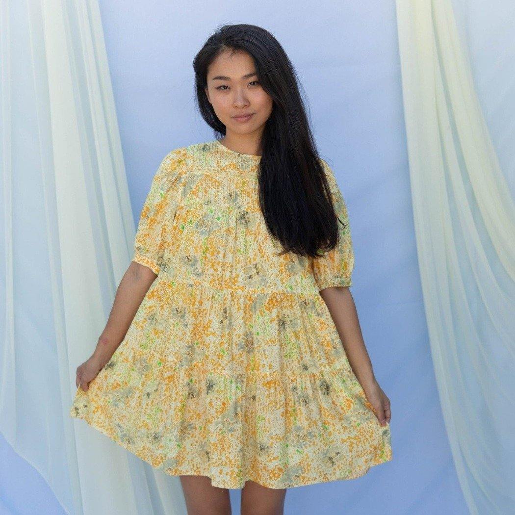 Splatter printed dress with different shades of yellow. Skies for Miles.