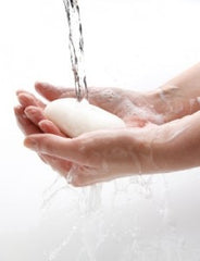 Washing hands with breastmilk soap