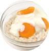 Image of porridge with yoghurt and sliced peaches