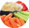 Image of carrot, celery, tomatoes and a hummus dip