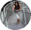 Image of a woman walking up the stairs at work