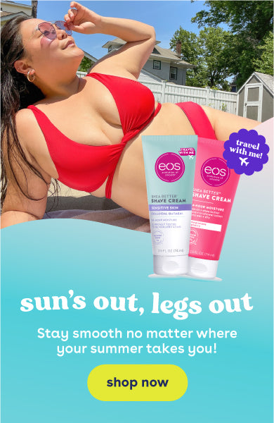 Girl sunbathing outside with 2 eos travel shave cream bottles next to her. Sun's out, legs out