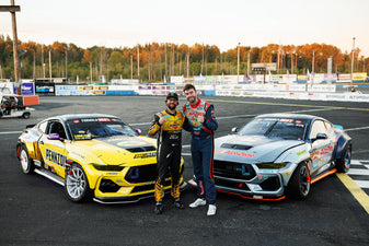 Chelsea DeNofa and James Deane stand in front of their Mustang RTR Spec 5 FD's