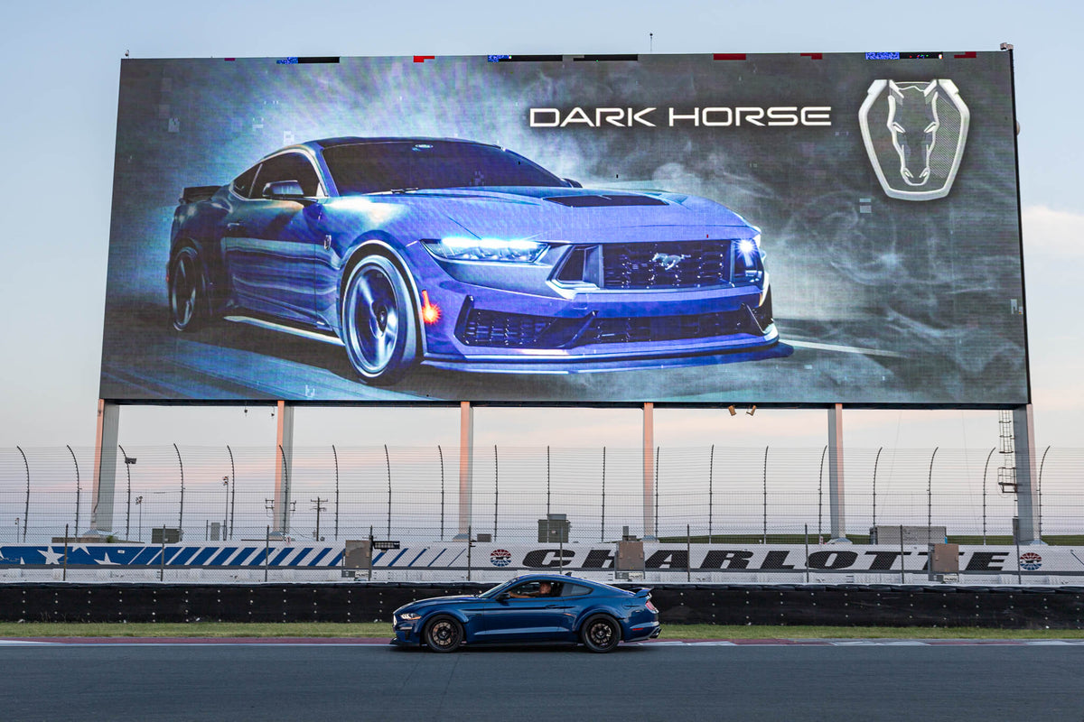 Toms Mustang RTR Spec 5 in front of Dark Horse R reveal banner