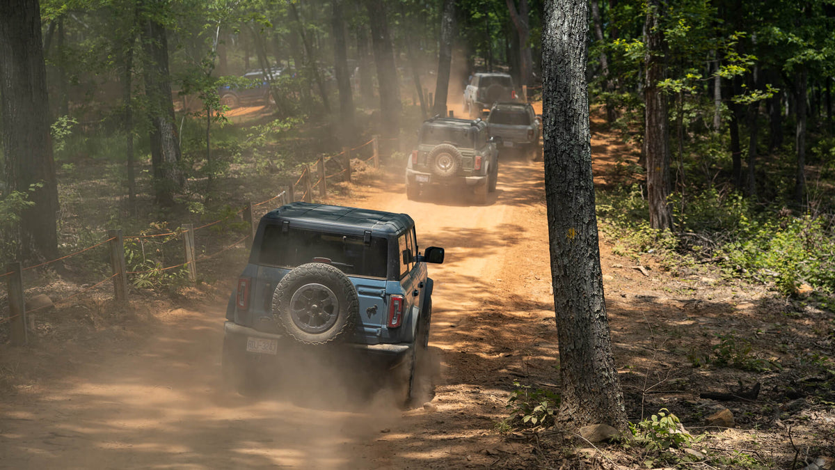Bronco RTR driving down off-road path in woods