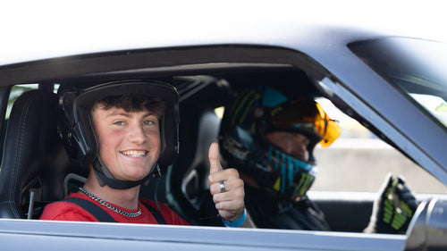 Man gives thumbs up in passenger seat of 2024 Mustang RTR Spec 2