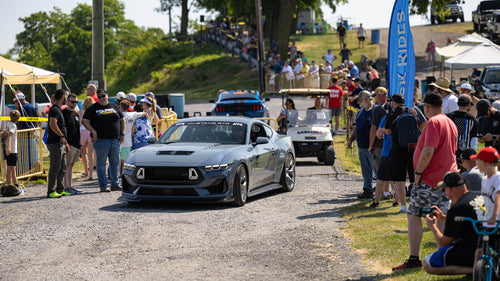 2024 Mustang RTR drives on path during event as people watch