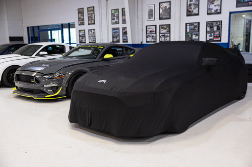 Covered 2023 Mustang RTR Spec 5 next to Mustang RTR Spec 5 10th anniversary edition