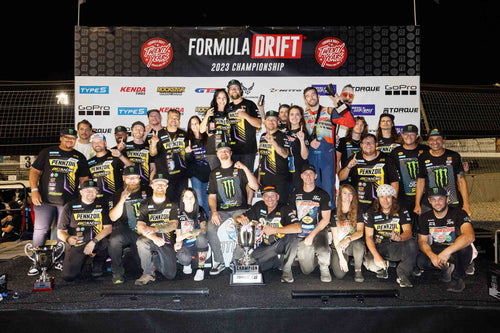 Chelsea DeNofa and team celebrate his 2023 Formula Drift Championship on the Formula Drift podium