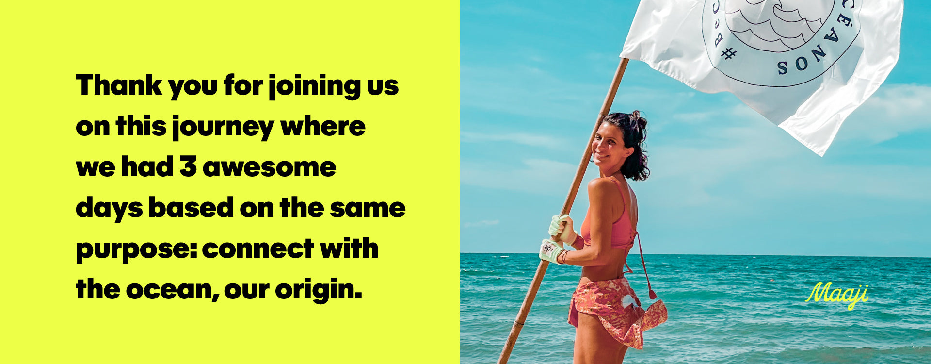 Toya Montoya, a Colombian model, wearing a Maaji bathing suit and rashguard while holding a flag at the beach.