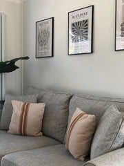 Neutral sofa with artwork above 
