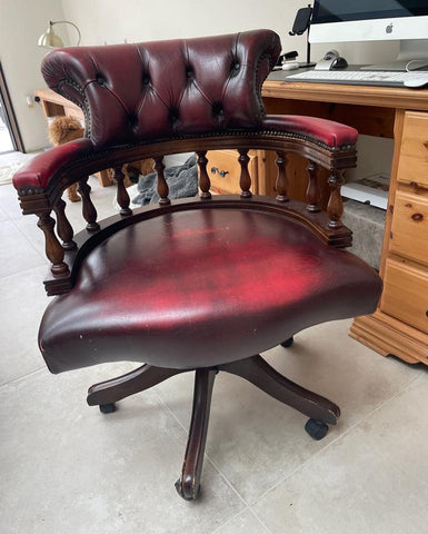 Dark wood and red leather captains chair