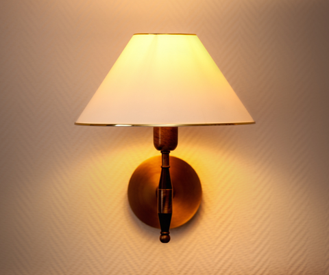 Wall sconce lamp with brass hardware and white shade