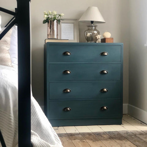 Hand painted chest of drawers in blue with a neutral bedroom