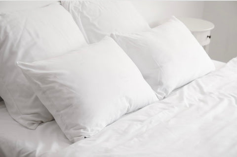 White bedding, duvet and pillows