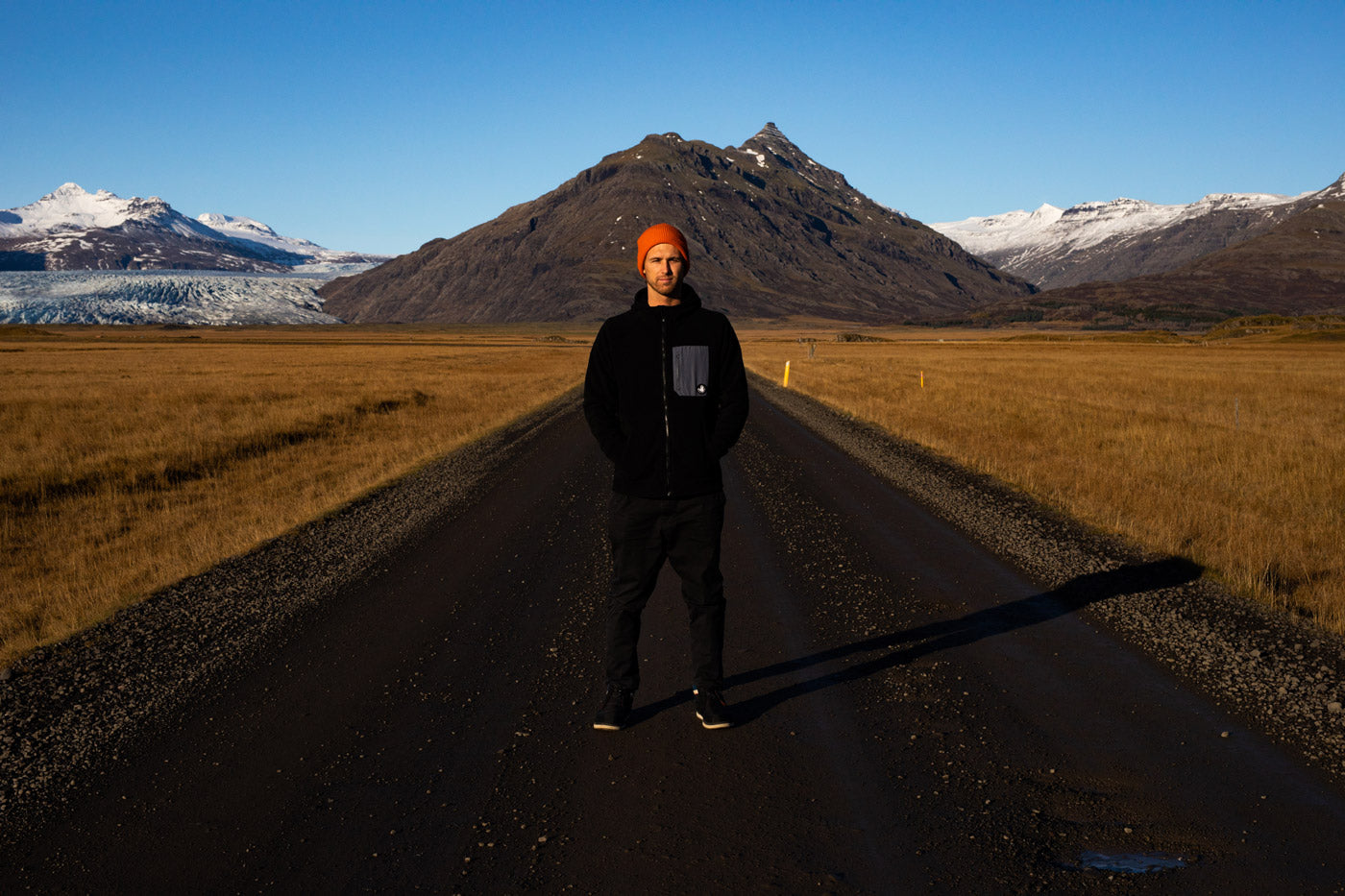 Jesse Mendes standing in the middle of the road in Iceland