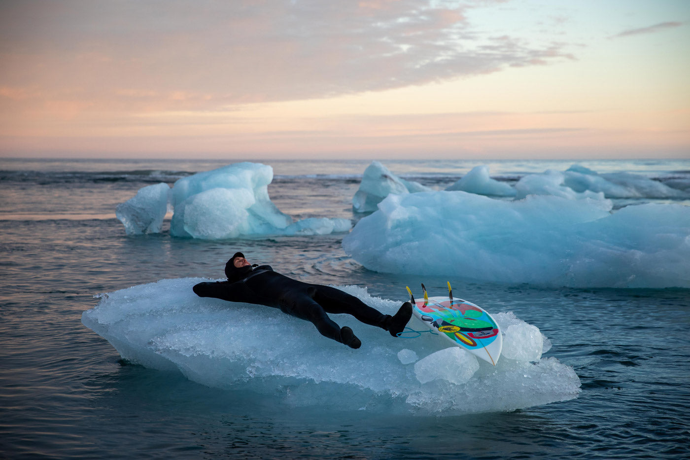 Jesse Mendes resting on an iceberg in Iceland