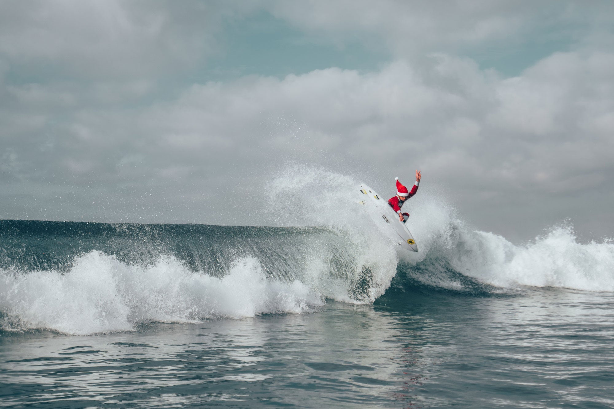 Santa Surfing Above The Lip