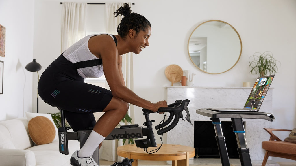 Woman training indoors on Wahoo Bike