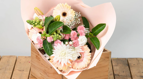 pastel pink and peach and white coloured bouquet demonstrating biosecurity on imported flowers