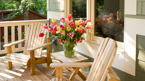 image of a bright mix of bohemian flower style on a wooden outdoor set