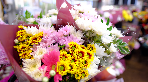 close up of multi-hued flower bouquets with yellow, hot pink and light purple for brisbane flower delivery to aged care facilities