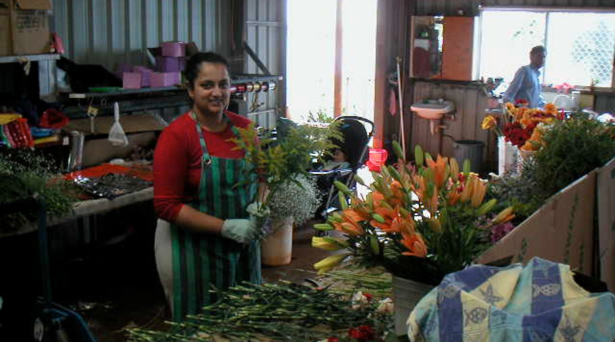 Image of Flower Farm employees working with cut flowers