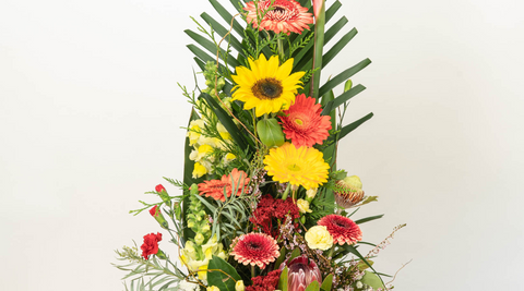 image of one of flower farm's stunning tall arrangements featuring gerberas, flowers direct from farm