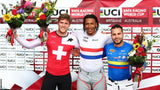 image of three BMX World Champions on the podium holding The Flower Farm podium flower arrangements