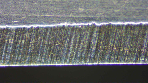 Uneven scratches on the blade, under microscope